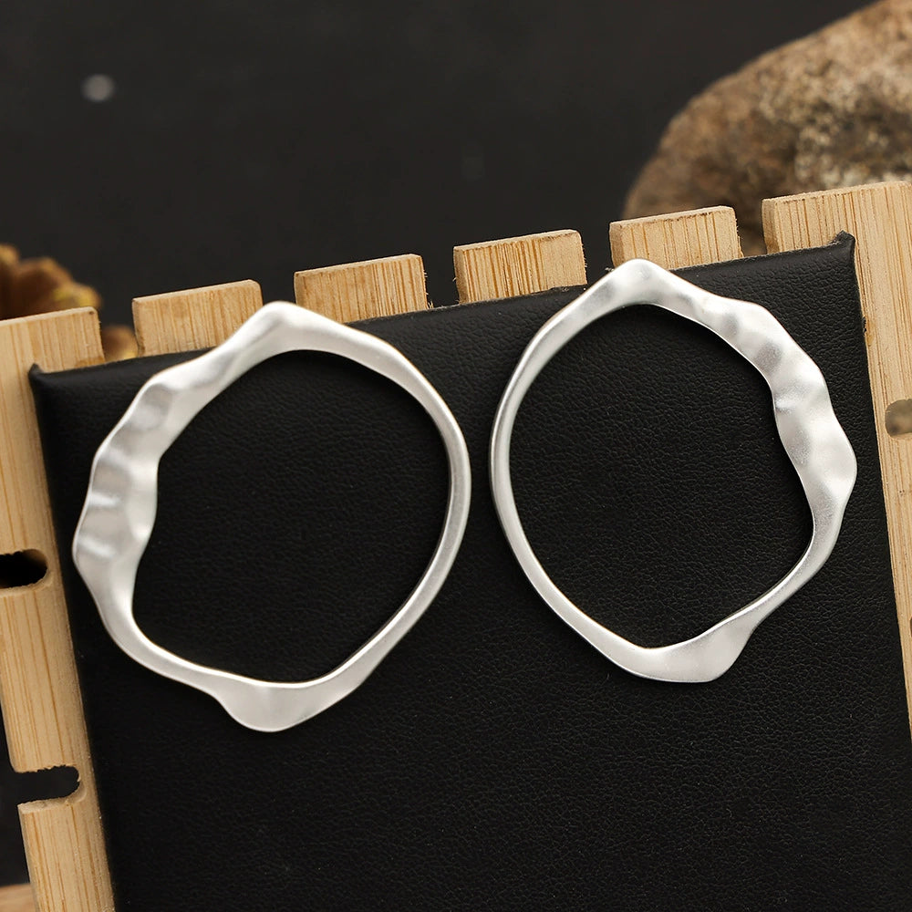 Gold-tone geometric earrings by Yoshan