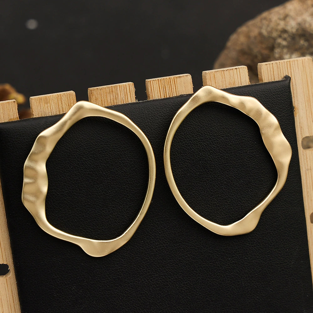 Gold-tone geometric earrings by Yoshan, detail view 2