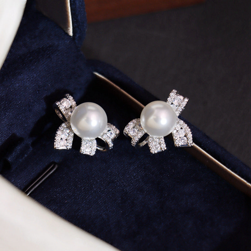 Pearl bow stud earrings by Yoshan, detail view 5