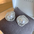 Pearl stud earrings by Yoshan