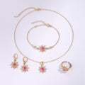 Gold crystal stud earrings by Yoshan