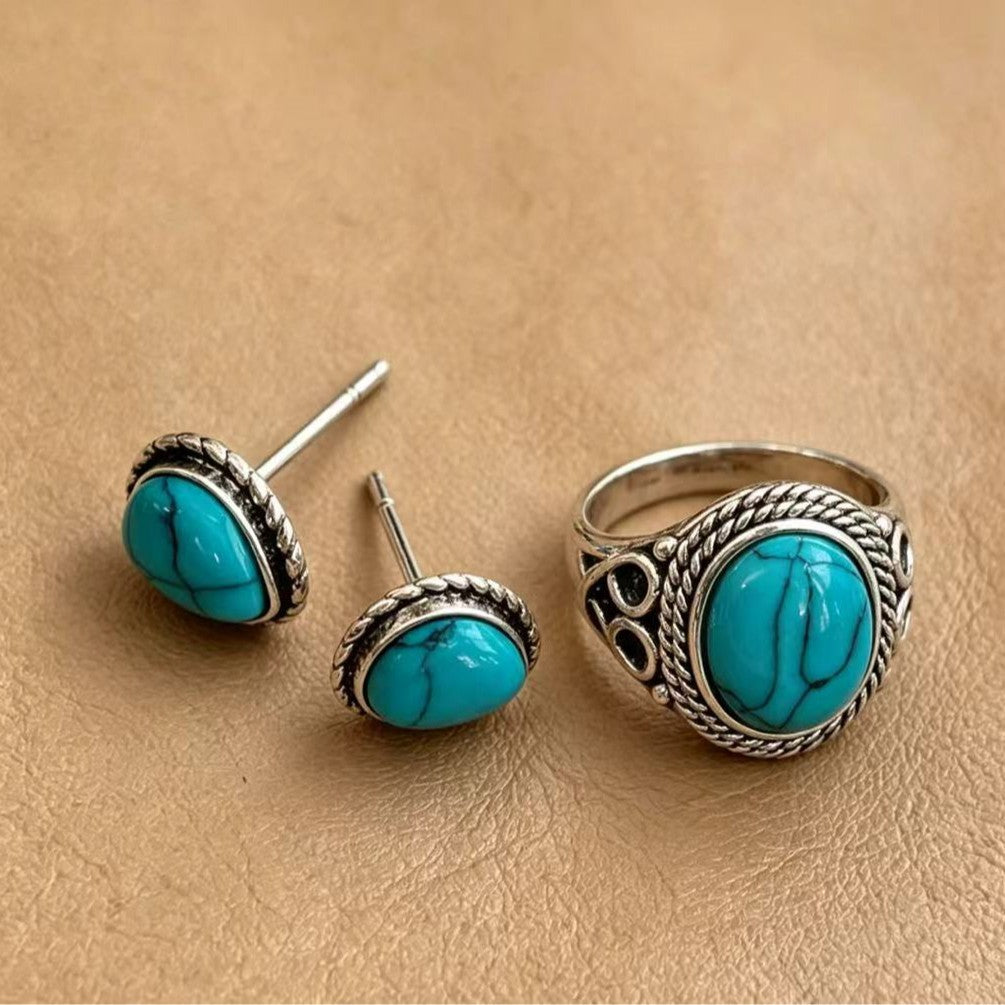 Green stud earrings by Yoshan