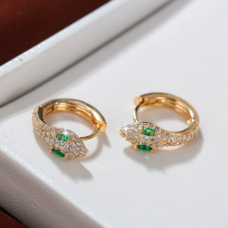 Gold hoop earrings by Yoshan