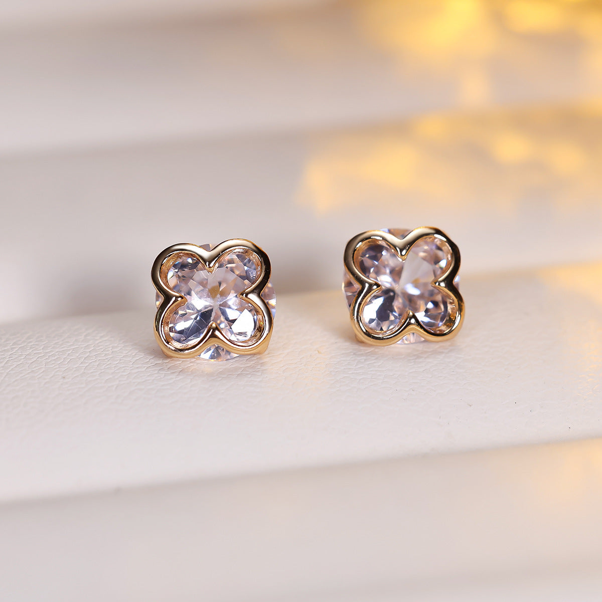 Cubic zirconia floral stud earrings by Yoshan, detail view 4