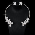 Silver cubic zirconia floral earrings by Yoshan