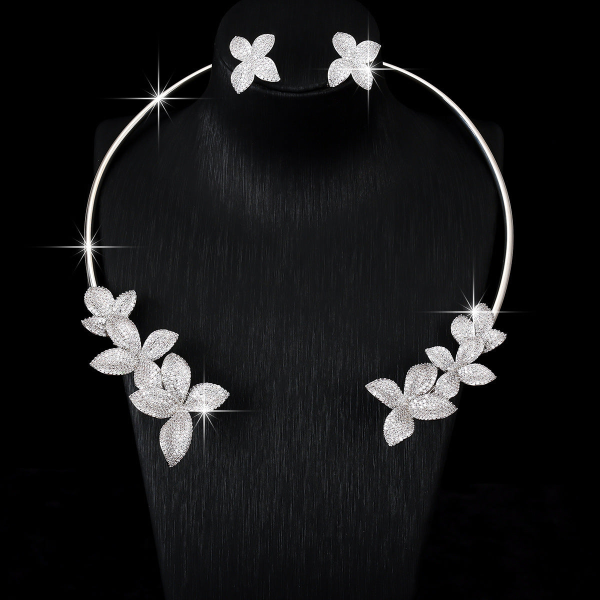 Silver cubic zirconia floral earrings by Yoshan