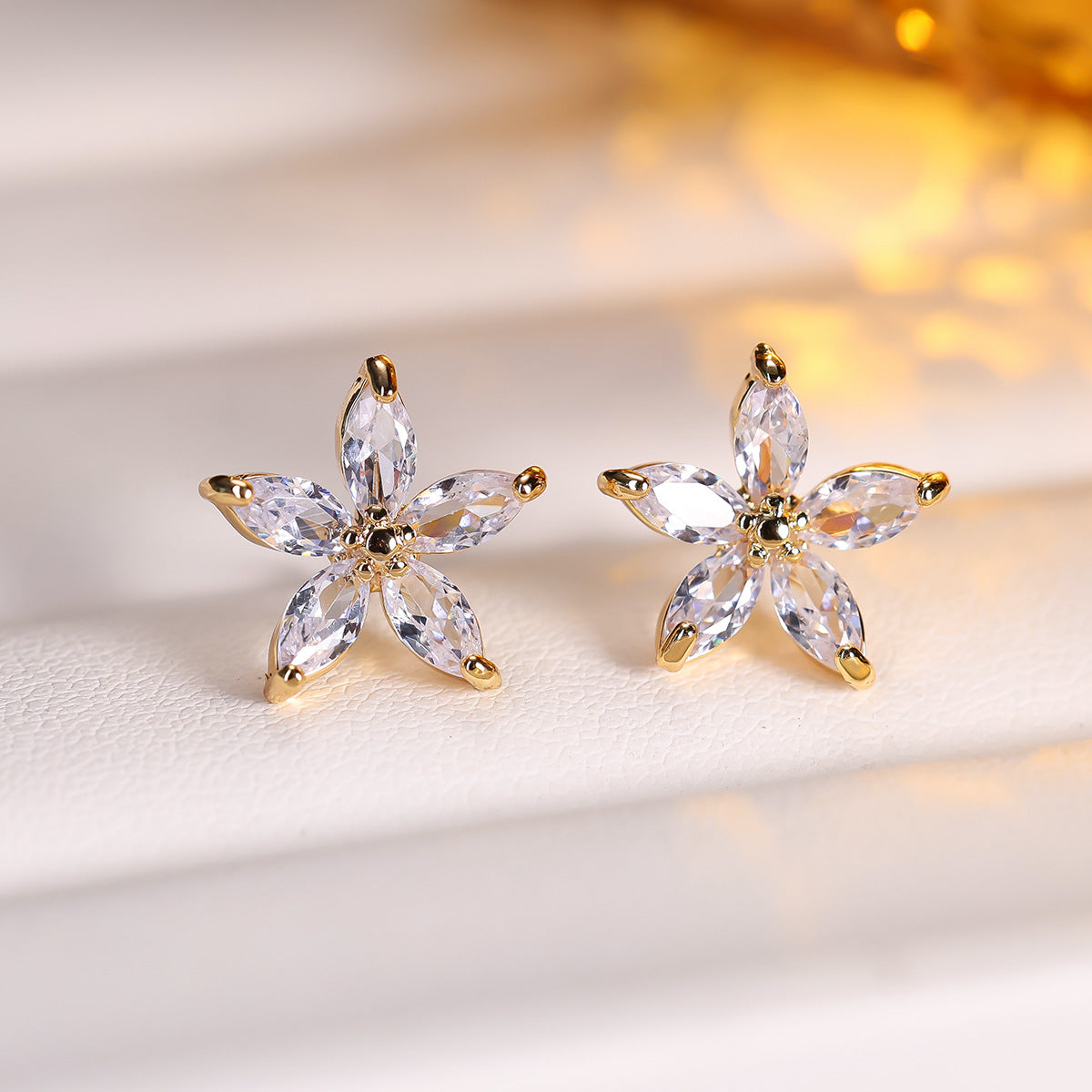 Cubic zirconia floral stud earrings by Yoshan, detail view 3
