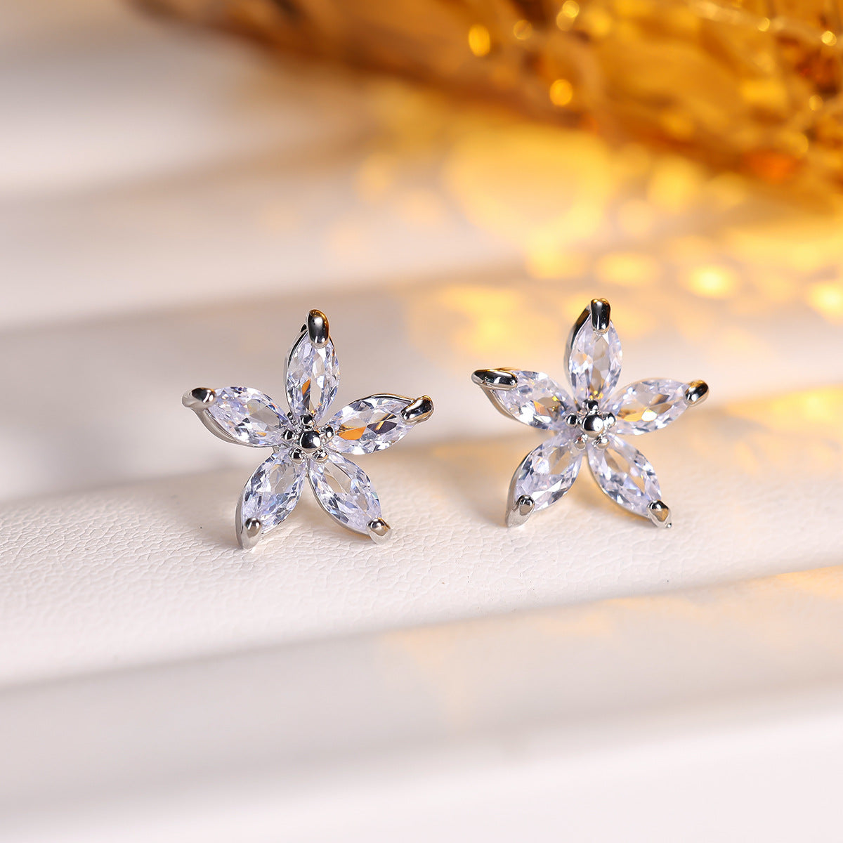 Cubic zirconia floral stud earrings by Yoshan, detail view 4