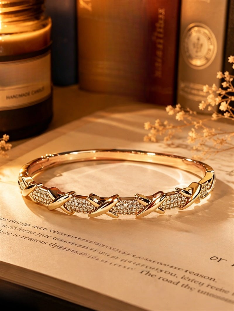 Gold geometric cuff bracelet by Yoshan