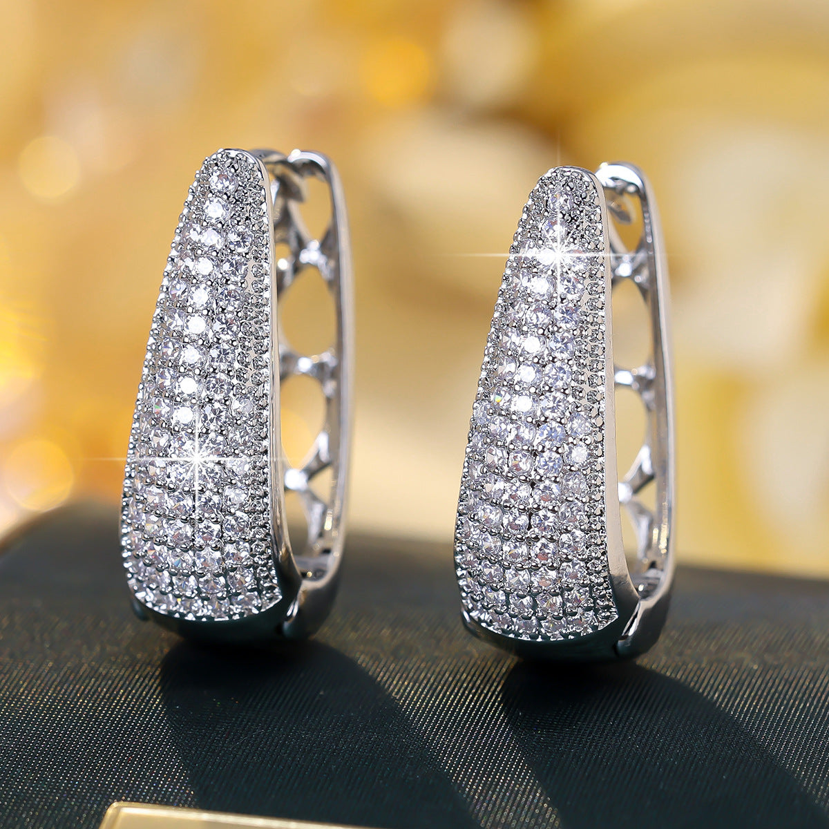 Cubic zirconia cutout stud earrings by Yoshan, detail view 2