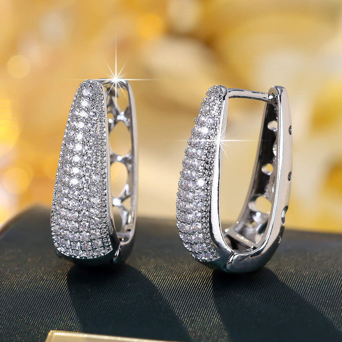 Cubic zirconia cutout stud earrings by Yoshan, detail view 3
