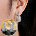 Silver cubic zirconia cutout stud earrings by Yoshan