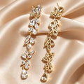 Gold cubic zirconia stud earrings by Yoshan