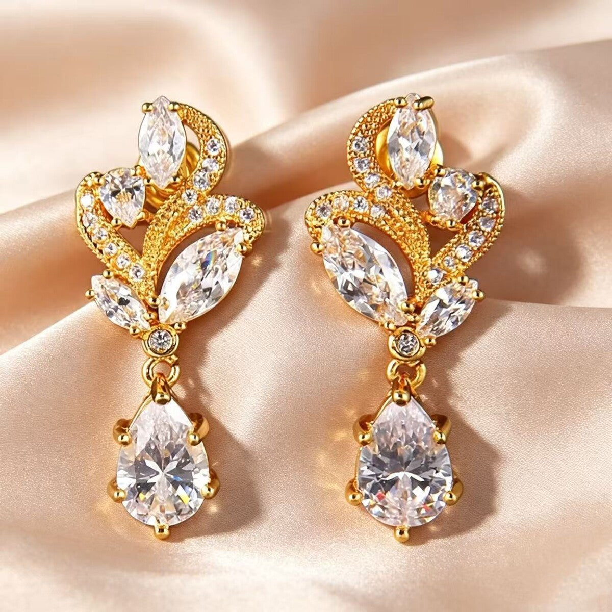 Gold stud earrings by Yoshan