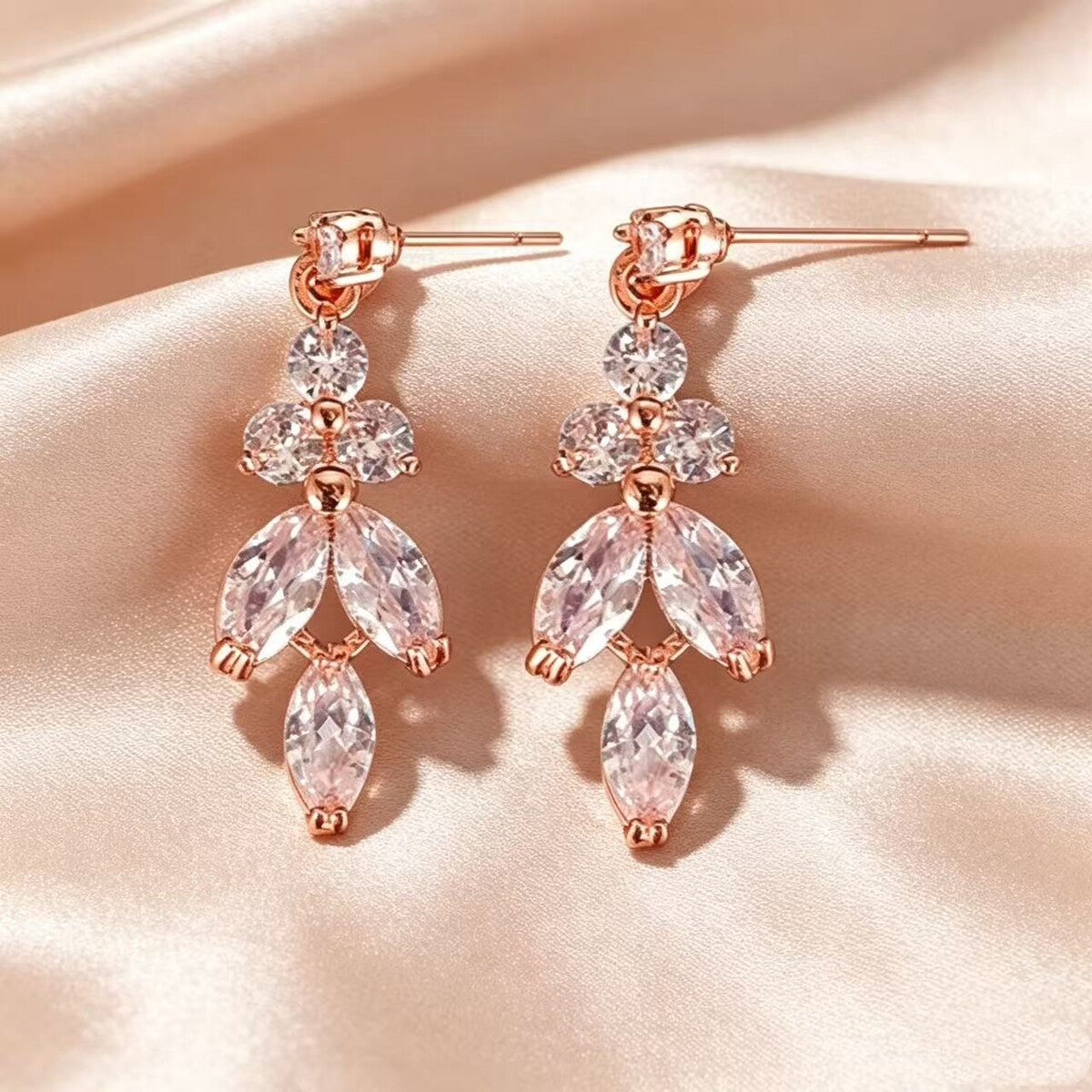Gold cubic zirconia earrings by Yoshan