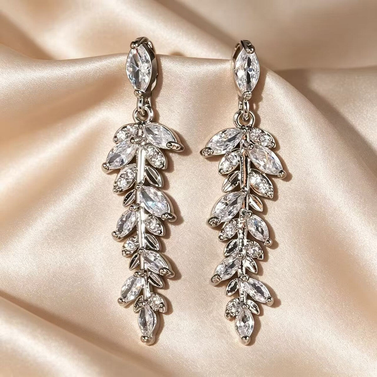 Cubic zirconia tassel stud earrings by Yoshan