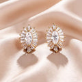 Gold cubic zirconia stud earrings by Yoshan