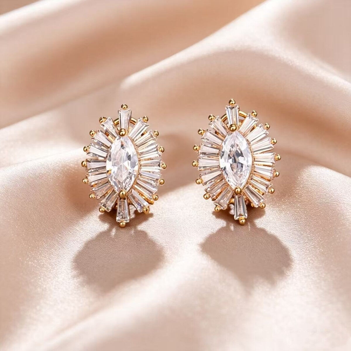 Gold cubic zirconia stud earrings by Yoshan