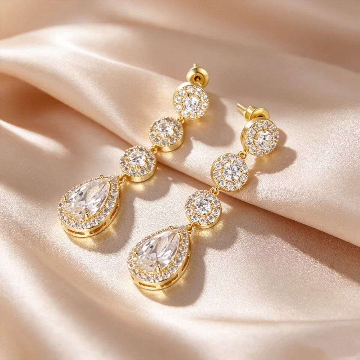 Gold cubic zirconia stud earrings by Yoshan