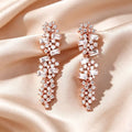 Gold cubic zirconia tassel stud earrings by Yoshan