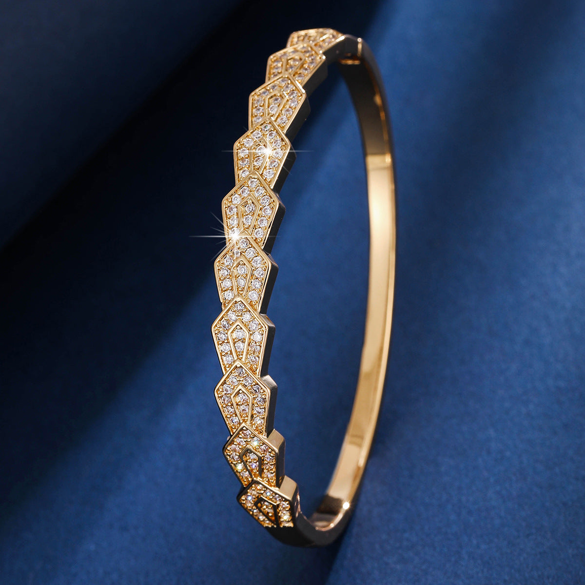 Gold geometric cuff bracelet by Yoshan