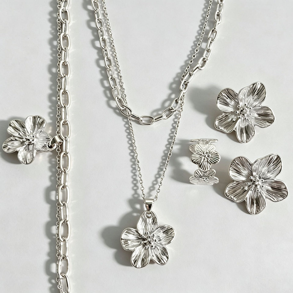 Silver floral earrings by Yoshan