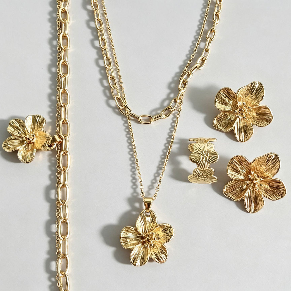 Gold floral earrings by Yoshan
