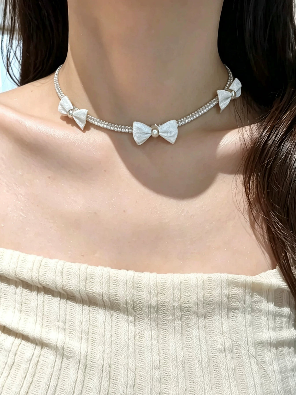 Pearl bow pendant necklace by Yoshan