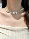 Pearl bow pendant necklace by Yoshan