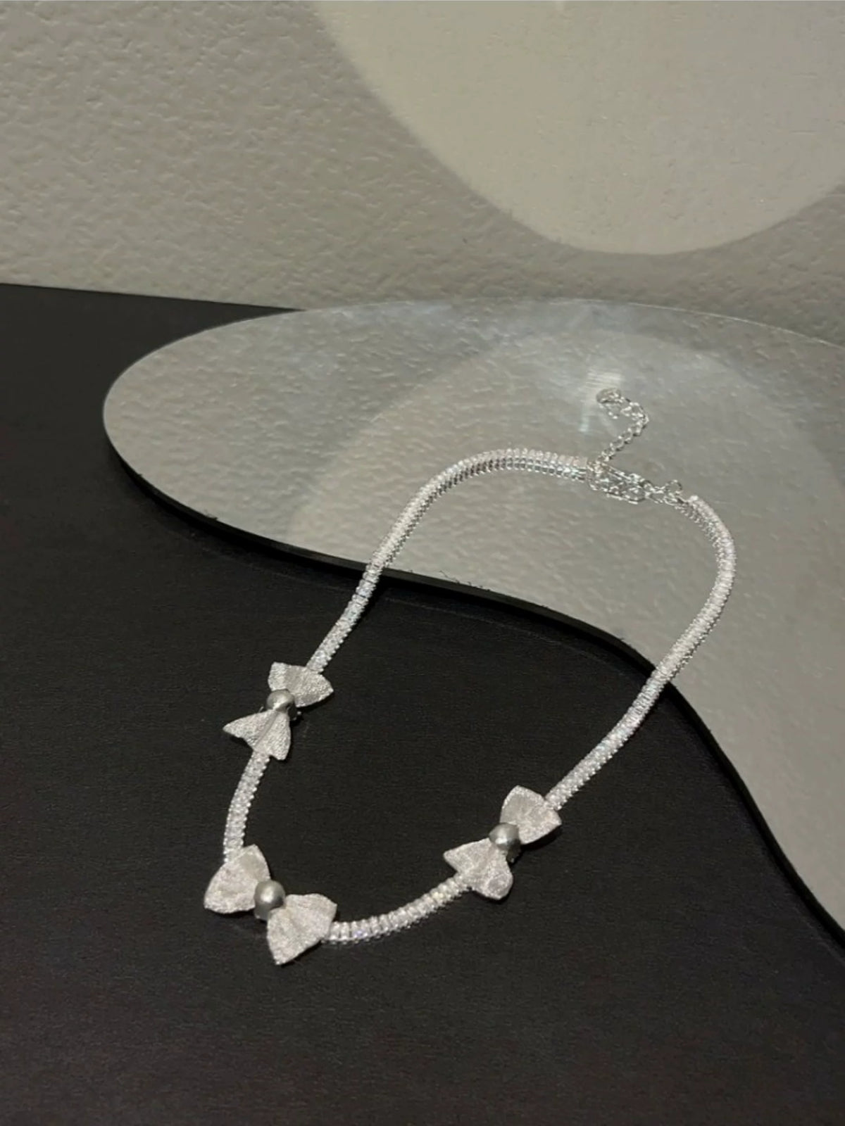Pearl bow pendant necklace by Yoshan, detail view 2