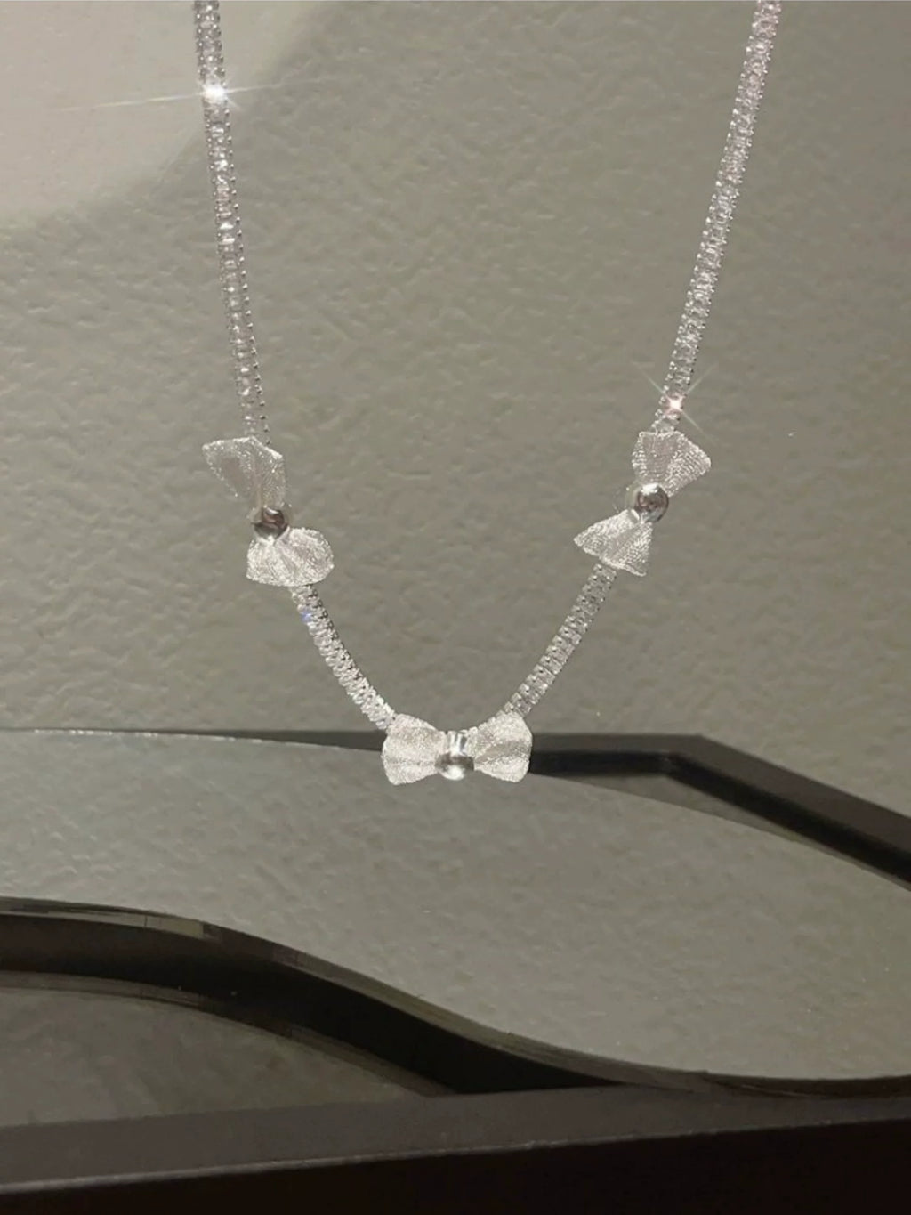 Pearl bow pendant necklace by Yoshan, detail view 3