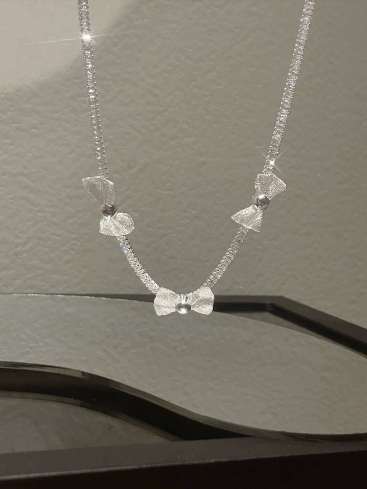 Pearl bow pendant necklace by Yoshan, detail view 3