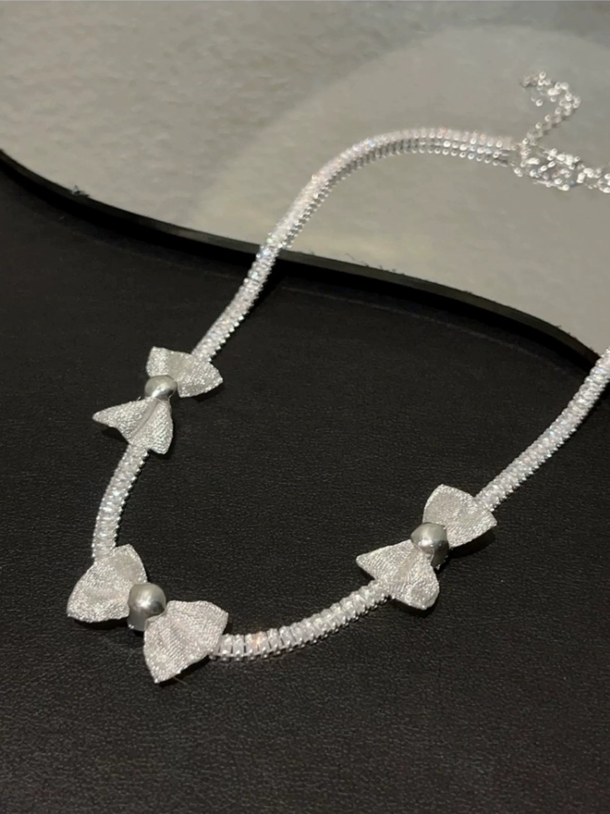 Pearl bow pendant necklace by Yoshan, detail view 4