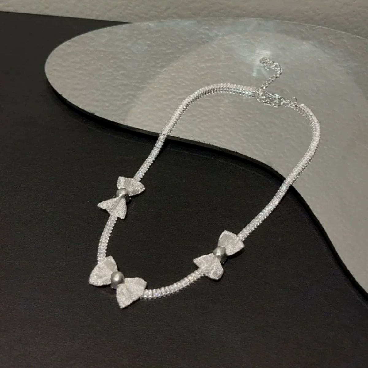 Pearl bow pendant necklace by Yoshan, detail view 7