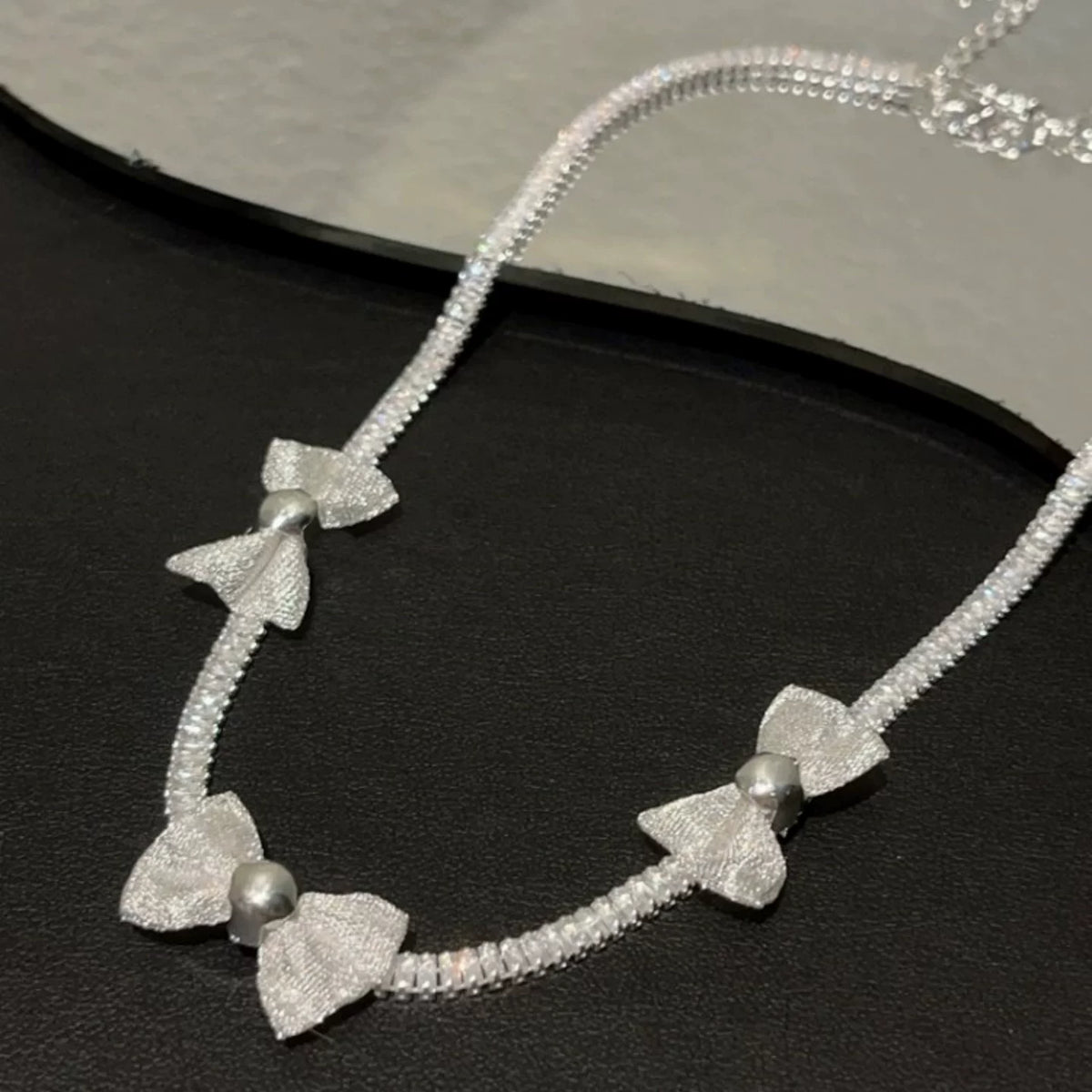 Pearl bow pendant necklace by Yoshan, detail view 8