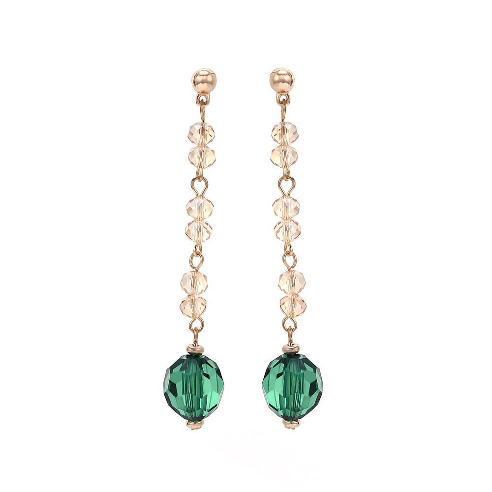 Green tassel drop earrings by Yoshan