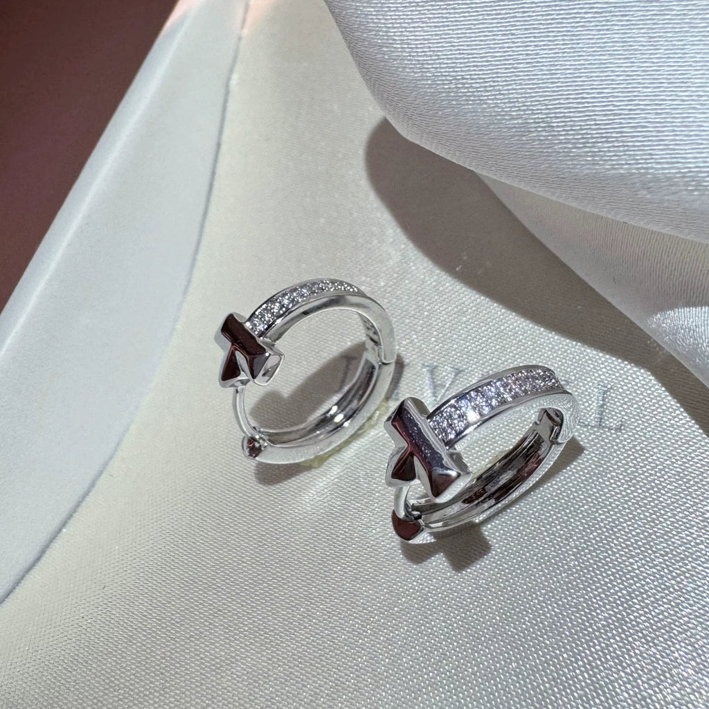 Silver crystal drop earrings by Yoshan