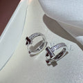 Silver crystal drop earrings by Yoshan