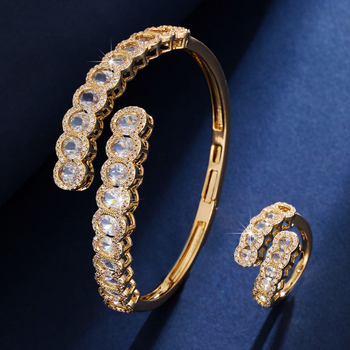 Gold cubic zirconia earrings by Yoshan