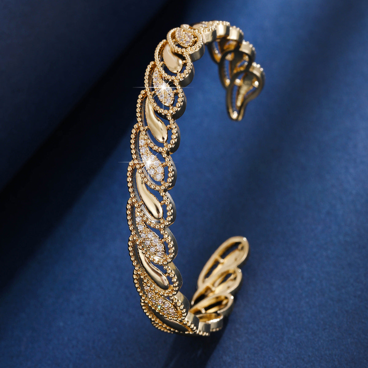 Gold cubic zirconia cutout cuff bracelet by Yoshan