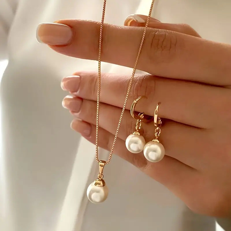 Gold pearl earrings by Yoshan