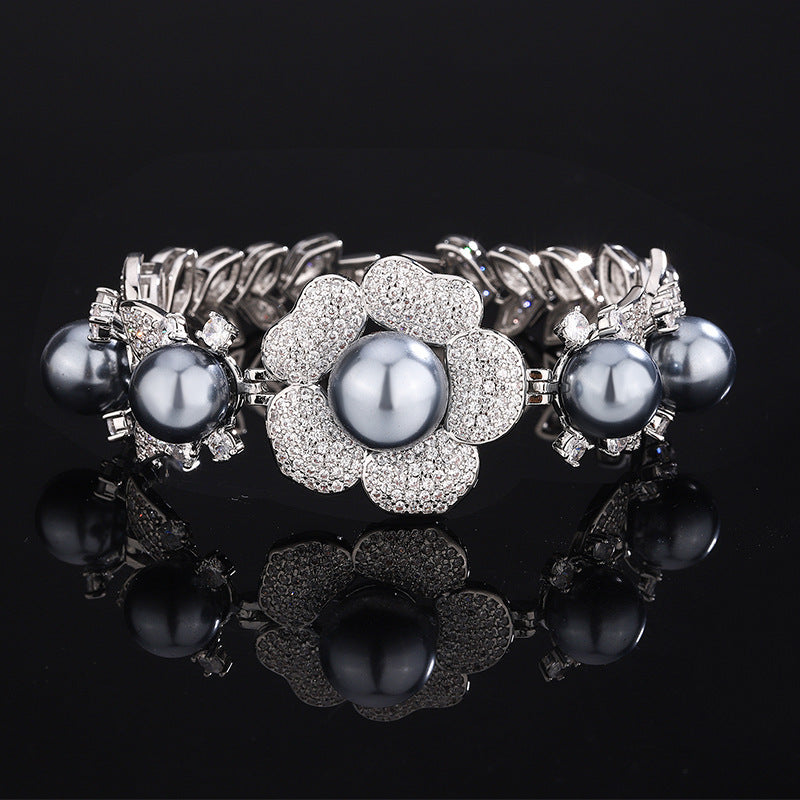 Grey faux pearl floral cuff bracelet by Yoshan