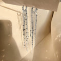 Heart tassel drop earrings by Yoshan