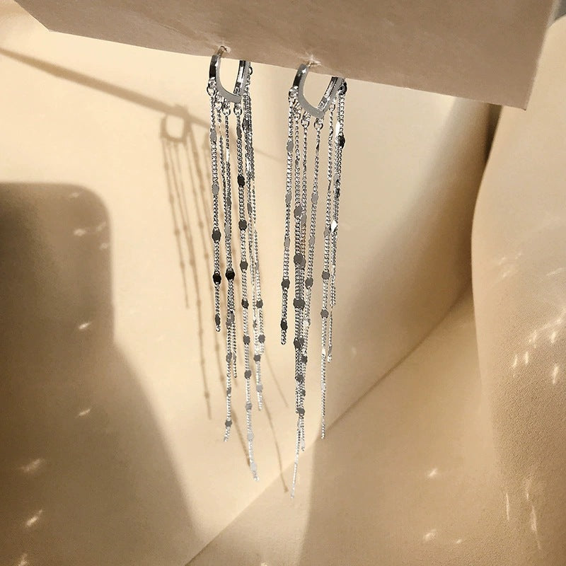 Heart tassel drop earrings by Yoshan