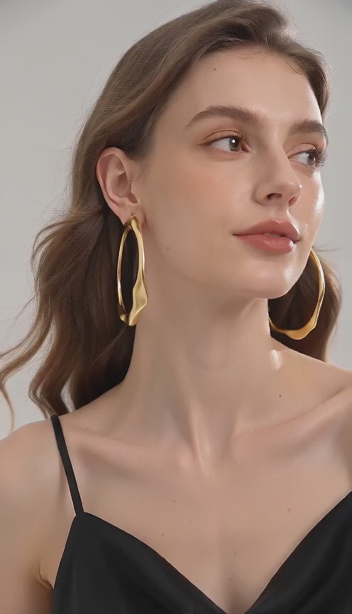 Video of gold-tone geometric earrings by Yoshan